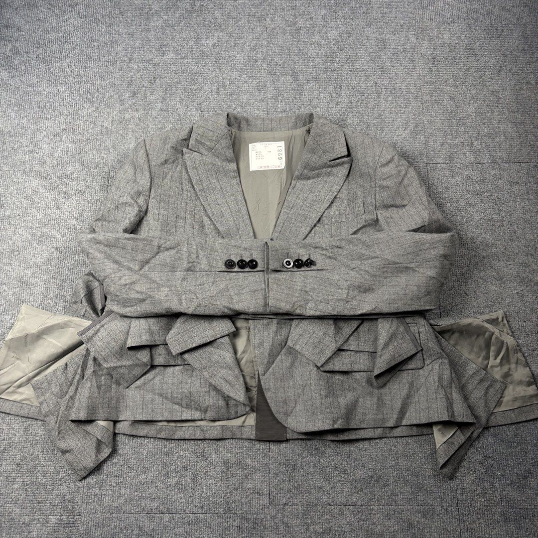 Sacai Gray Striped Blazer (Category: Luxury Apparel) located in Manila. Submitted by yourtherapist_ (Listing ID 1468246862, Image 3). Description: Sacai Gray Striped Blazer Size: 1 Condition: Excellent Flaw: 1 broken button on cuffs Material: Outside 100% Wool Made in: Japan Measurements Width: 20 Length: 23 Shoulder: 17 Sleeve: 23 8,000.