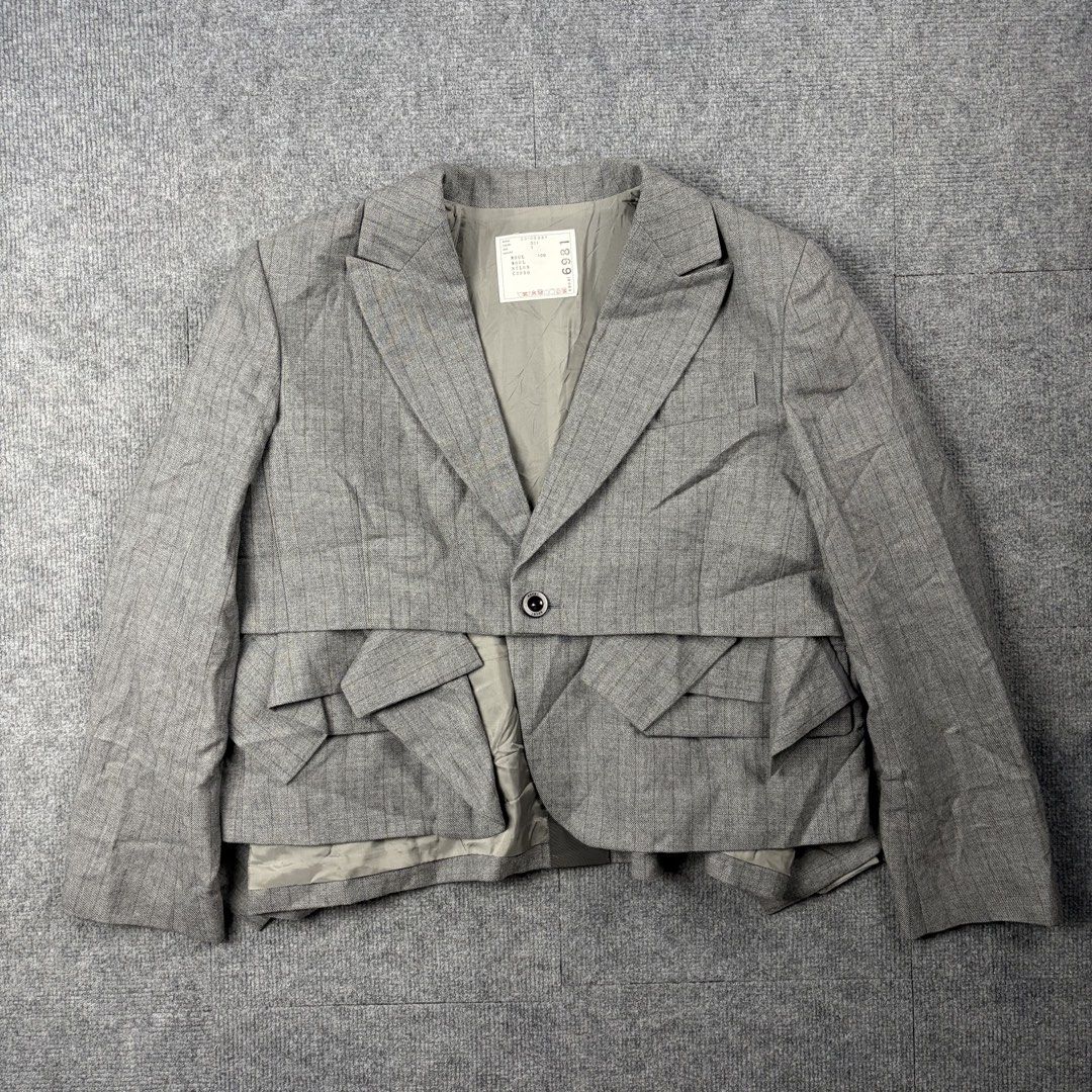 Sacai Gray Striped Blazer (Category: Luxury Apparel) located in Manila. Submitted by yourtherapist_ (Listing ID 1468246862, Image 2). Description: Sacai Gray Striped Blazer Size: 1 Condition: Excellent Flaw: 1 broken button on cuffs Material: Outside 100% Wool Made in: Japan Measurements Width: 20 Length: 23 Shoulder: 17 Sleeve: 23 8,000.