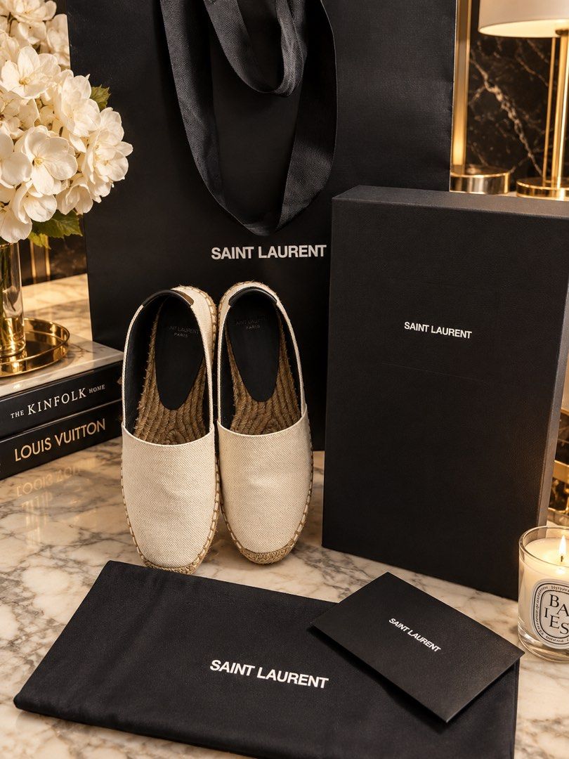 Saint Laurent Canvas Espadrilles (Category: Sneakers & Footwear) located in Pasig City. Submitted by hicupqueen (Listing ID 1468100684, Image 1). Description: Brand: Saint Laurent Style: Canvas espadrilles / slip-on summer footwear Color: Cream with black leather heel tab Sole: Classic jute braided sole Inclusions: Complete set with original shoe box, paper bag, dust bag, and information card Condition: Excellent, meticulously cared for Perfect f