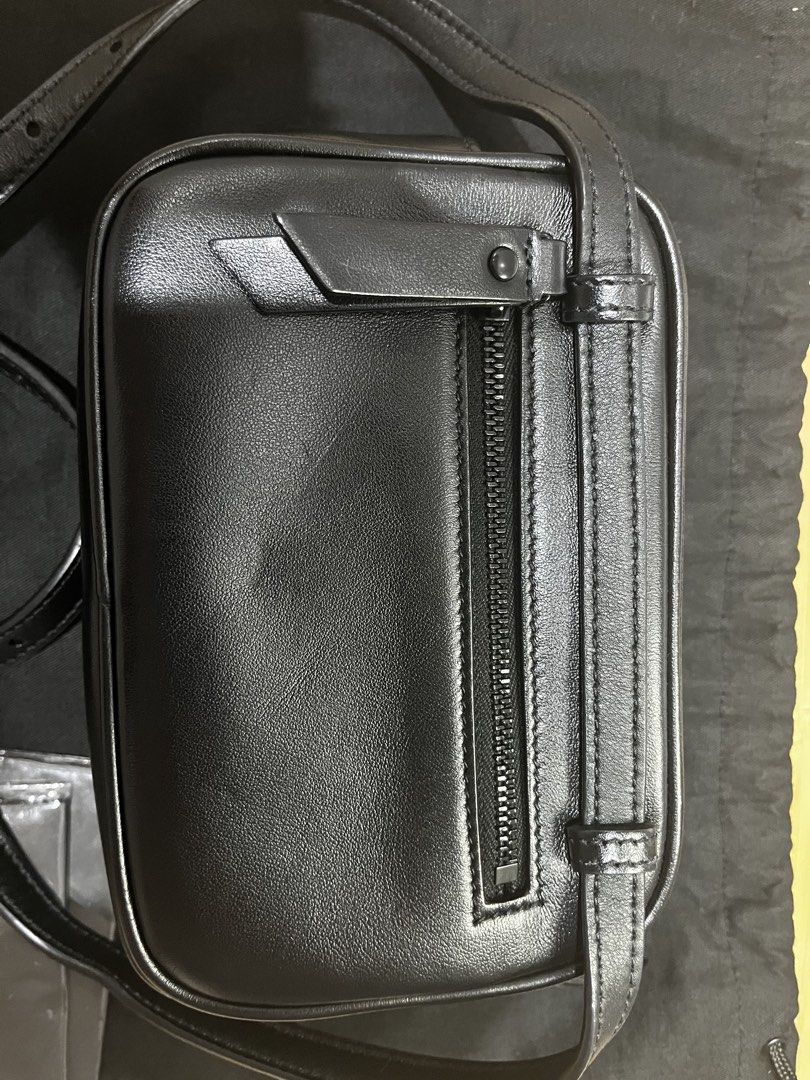 Saint Laurent Lou Camera Bag Black Hardware (Category: Cross-body Bags) located in Paranaque City. Submitted by relovedbymiranda (Listing ID 1468183001, Image 3). Description: - Authentic Saint Laurent camera bag in black chevron leather - Black on black edition - Dark hardware details throughout - Top zipper closure with a convenient back slip pocket - Adjustable leather strap featuring a stylish tassel accent -Tassel has YSL markings on the met