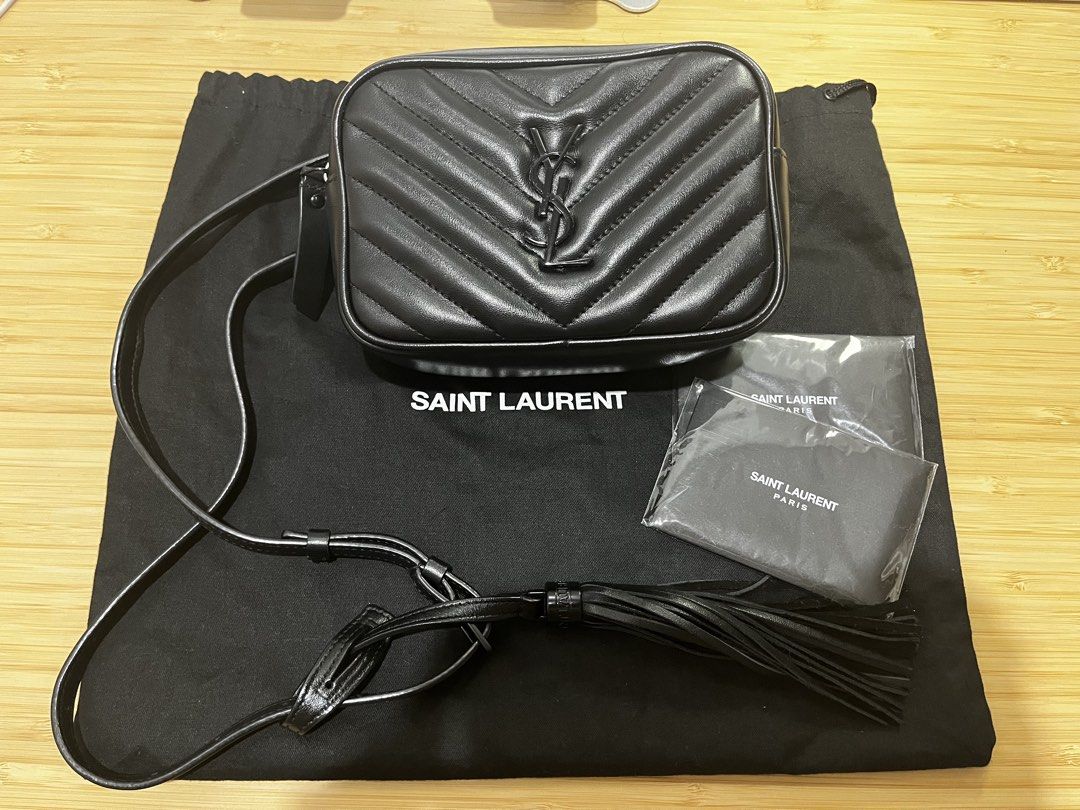 Saint Laurent Lou Camera Bag Black Hardware (Category: Cross-body Bags) located in Paranaque City. Submitted by relovedbymiranda (Listing ID 1468183001, Image 1). Description: - Authentic Saint Laurent camera bag in black chevron leather - Black on black edition - Dark hardware details throughout - Top zipper closure with a convenient back slip pocket - Adjustable leather strap featuring a stylish tassel accent -Tassel has YSL markings on the met