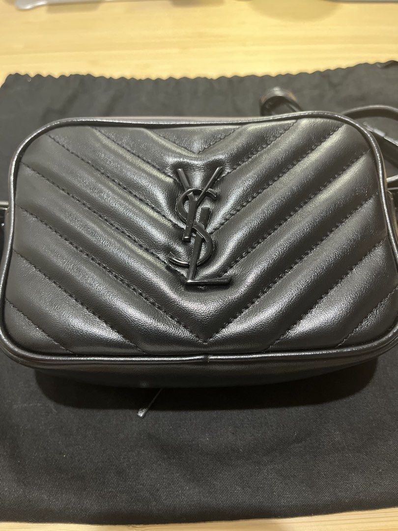 Saint Laurent Lou Camera Bag Black Hardware (Category: Cross-body Bags) located in Paranaque City. Submitted by relovedbymiranda (Listing ID 1468183001, Image 2). Description: - Authentic Saint Laurent camera bag in black chevron leather - Black on black edition - Dark hardware details throughout - Top zipper closure with a convenient back slip pocket - Adjustable leather strap featuring a stylish tassel accent -Tassel has YSL markings on the met