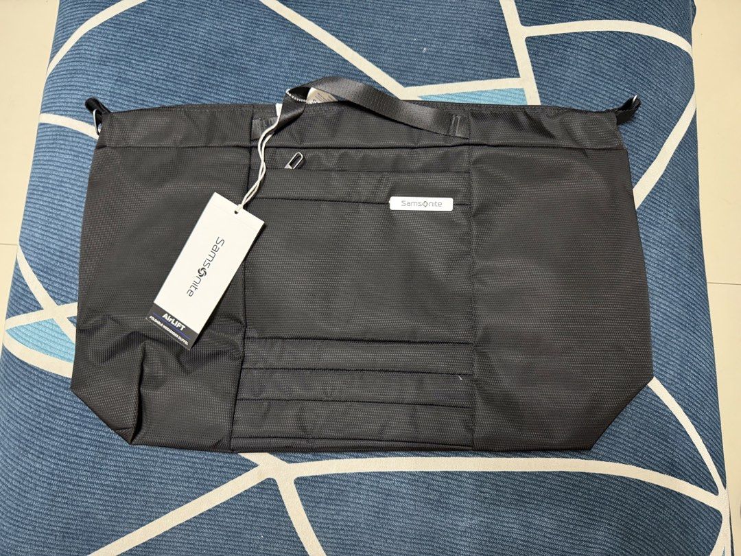 Samsonite Uplift Weekender Duffel (Category: Briefcases) located in Quezon City. Submitted by jamboreeee (Listing ID 1468233610, Image 2). Description: - Brand: Samsonite (Uplift Weekender Duffel) - Condition: Brand new with tags (BNWT) - Color: Classic Black - Dimensions: 23.2 inches wide - Storage: Spacious main compartment + front zippered pocket - Portability: Dual carry handles & detachable shoulder strap - Ideal for: Weekend trips, travels,
