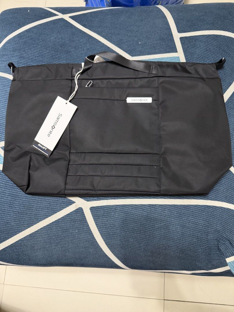 Samsonite Uplift Weekender Duffel (Category: Briefcases) located in Quezon City. Submitted by jamboreeee (Listing ID 1468233610, Image 3). Description: - Brand: Samsonite (Uplift Weekender Duffel) - Condition: Brand new with tags (BNWT) - Color: Classic Black - Dimensions: 23.2 inches wide - Storage: Spacious main compartment + front zippered pocket - Portability: Dual carry handles & detachable shoulder strap - Ideal for: Weekend trips, travels,