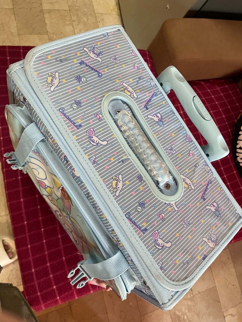 Sanrio Cinnamoroll Trolley Bag Rolling Backpack Blue (Category: Backpacks) located in Las Pinas. Submitted by vanenuu (Listing ID 1468091638, Image 2). Description: - Authentic Sanrio Cinnamoroll design in light blue and stylish stripes - Adorable cartoon graphics printed on the front and top flap - Convenient telescopic handle and extra front handle for easy carrying - Smooth-rolling wheels at the base for effortless travel - Spacious main compa