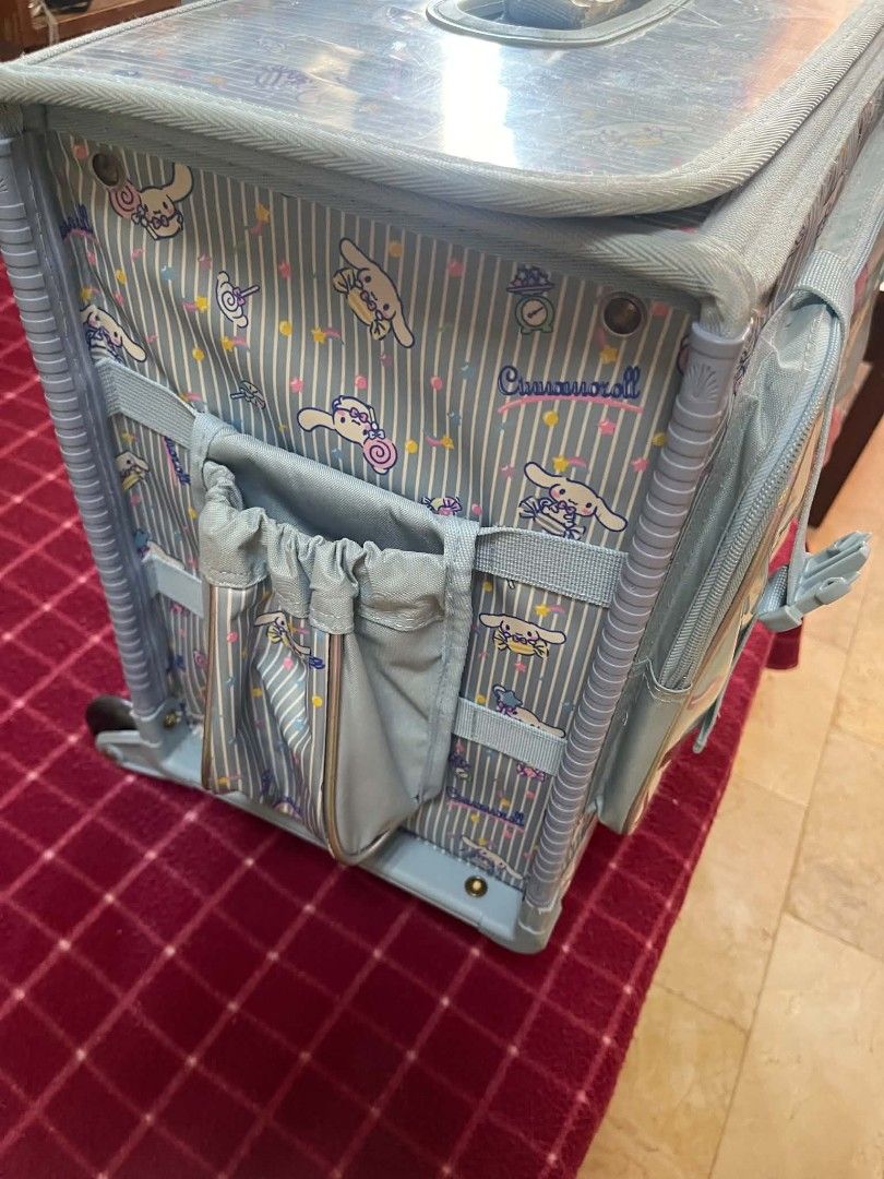 Sanrio Cinnamoroll Trolley Bag Rolling Backpack Blue (Category: Backpacks) located in Las Pinas. Submitted by vanenuu (Listing ID 1468091638, Image 3). Description: - Authentic Sanrio Cinnamoroll design in light blue and stylish stripes - Adorable cartoon graphics printed on the front and top flap - Convenient telescopic handle and extra front handle for easy carrying - Smooth-rolling wheels at the base for effortless travel - Spacious main compa