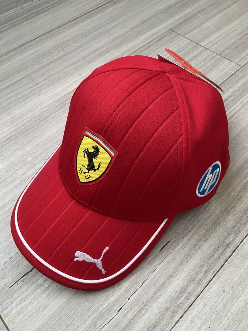 Scuderia Ferrari 2025 Team Baseball Cap (Category: Caps & Hats) located in Balagtas. Submitted by sammmmyy_ (Listing ID 1468149344, Image 1). Description: - 100% Authentic Puma x Scuderia Ferrari Team Cap - Brand new with original paper tags and plastic hook - Vibrant red colorway with stylish vertical striped panels - Iconic Ferrari shield logo on the front - HP logo on the side and white Puma cat logo on the brim - Adjustable snapback closure f