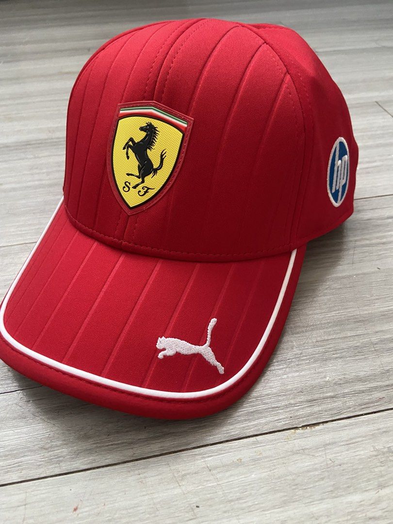Scuderia Ferrari 2025 Team Baseball Cap (Category: Caps & Hats) located in Balagtas. Submitted by sammmmyy_ (Listing ID 1468149344, Image 2). Description: - 100% Authentic Puma x Scuderia Ferrari Team Cap - Brand new with original paper tags and plastic hook - Vibrant red colorway with stylish vertical striped panels - Iconic Ferrari shield logo on the front - HP logo on the side and white Puma cat logo on the brim - Adjustable snapback closure f