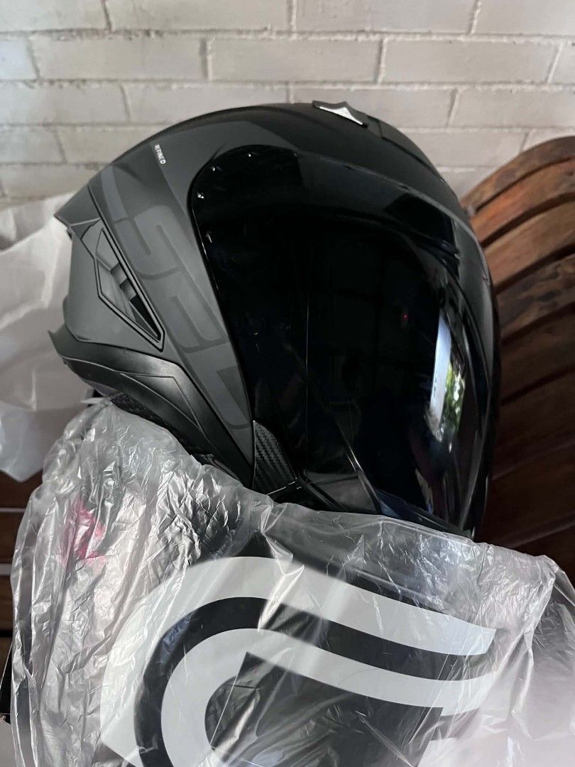 SEC Matte Black Half Face Motorcycle Helmet Size M (Category: Bicycles) located in Manila. Submitted by mr.panda1118 (Listing ID 1468124825, Image 2). Description: - Brand: SEC - Style: Matte black modular helmet with carbon fiber pattern accents - Size: Medium (57-58cm) with fully lined SEC branded padding - Visor: Includes a clear outer shield and built-in internal sun visor - Packaging: Comes complete in its original box - Condition: Excellent