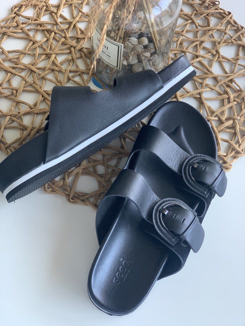 Seed Heritage Black Double Buckle Slide Sandals (Category: Flats & Sandals) located in Quezon City. Submitted by angge1013 (Listing ID 1468090265, Image 2). Description: - Brand: Seed Heritage - Color: Solid black - Design: Double strap with chunky buckle closures - Comfort: Contoured footbed for all-day wear - Sole: Platform style featuring a stylish contrasting white stripe - Condition: Immaculate, clean soles and footbeds with no scuffs or mar