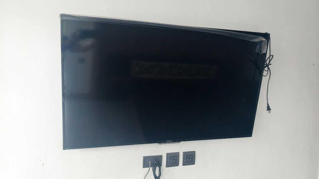 Sharp Aquos 2T-C50CG1X LED Backlight TV (Category: TV) located in Pasay City. Submitted by rin26_cy (Listing ID 1468140917, Image 1). Description: - Brand/Model: Sharp LED TV (Model: 2T-C50CG1X, S/N: 106715893) - Screen Size: 50 inches - Audio/Ports: Dolby Audio, HDMI, LAN, and AV input - Power: 110-240V - Origin: Made in Malaysia - Condition: Excellent, protective plastic film still on the top edge - Mounting: Currently wall-mounted 3pcs availab