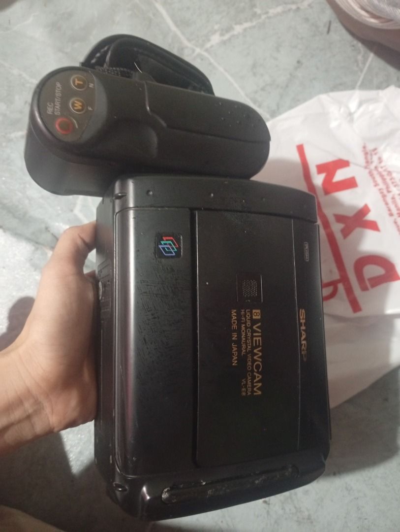 Sharp Viewcam 8 Liquid Crystal Video Camera VL-E8 (Category: Video Cameras) located in Caloocan City. Submitted by wildgem.3835b2 (Listing ID 1468270915, Image 2). Description: - Vintage Sharp Viewcam 8 liquid crystal video camera (Model: VL-E8) - Made in Japan with -fi monaural sound recording - Features a built-in LCD screen and convenient top hand strap - Classic tape-based setup ideal for retro tech collectors and analog videographers.