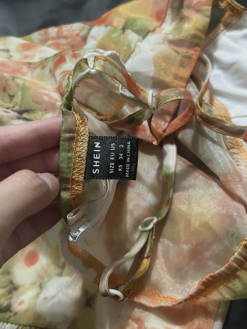 Shein Floral Mini Dress (Category: Dresses) located in Manila. Submitted by prelovedwithmaui (Listing ID 1468239371, Image 2). Description: Serving major cottage core, summer vibes! 🧡✨ This SHEIN floral organza mini dress features a flattering bustier top and flared drop-waist skirt. Perfect for dates, brunch, or outdoor events. Price: ₱350 php only Size: Extra Small Condition: Pre-loved | As-is DM to grab before it’s gone! 🤗.