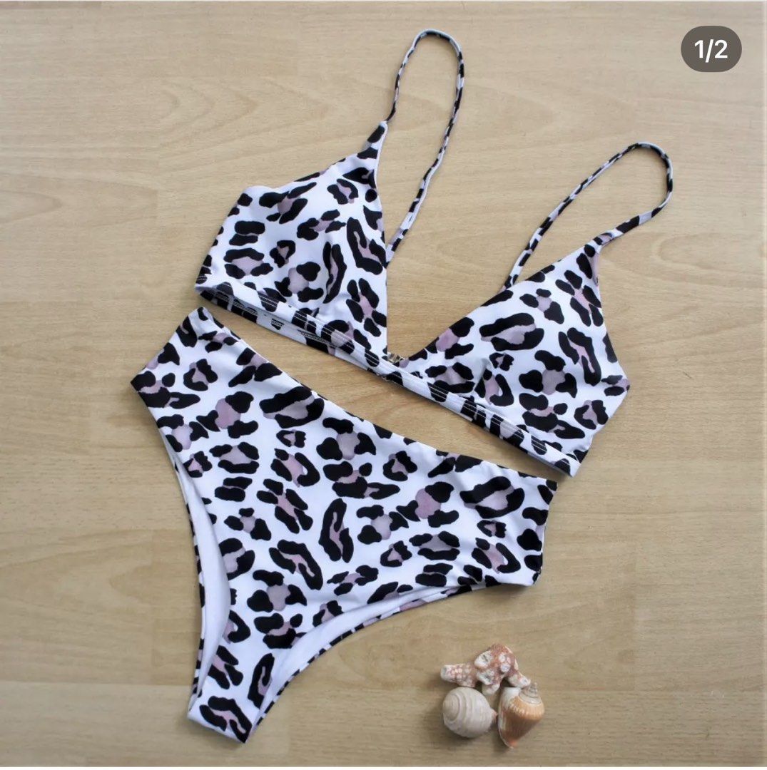 SHEIN Leopard Print High Waist Bikini Set Size L (Category: Bikinis & Swimsuits) located in Bulacan. Submitted by peach1025 (Listing ID 1468066794, Image 1). Description: - Brand: SHEIN - Condition: Brand new, never worn with tags attached - Size: L - Design: White base with black and pinkish-grey animal print - Top: Triangle style with adjustable thin straps and back clasp - Bottoms: High-waisted with high-cut legs - Material: 82% polyester, 18%