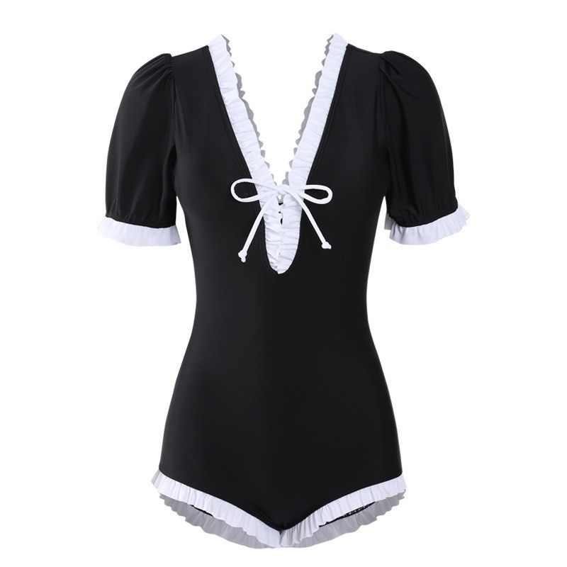 Shein Padded Ruffled Swimsuit (Category: Bikinis & Swimsuits) located in Binan City. Submitted by myprelovedhaul (Listing ID 1468069864, Image 1). Description: The image shows a black and white maid-style one-piece swimsuit featuring a V-neckline with white ruffles, short puffy sleeves, a front tie accent, and a ruffled leg opening..