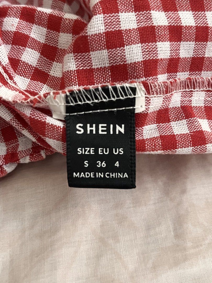 SHEIN Red White Gingham Checkered Camisole Top Size S (Category: Sleeveless) located in Marikina City. Submitted by yeun0923 (Listing ID 1468099431, Image 2). Description: - GCASH MOP - Buyer handles SF - JRS or Lalamove - Details: Thin adjustable straps, gathered ruched bust, and flowy peplum hem - Material: Lightweight fabric, ideal for warm weather or layering.