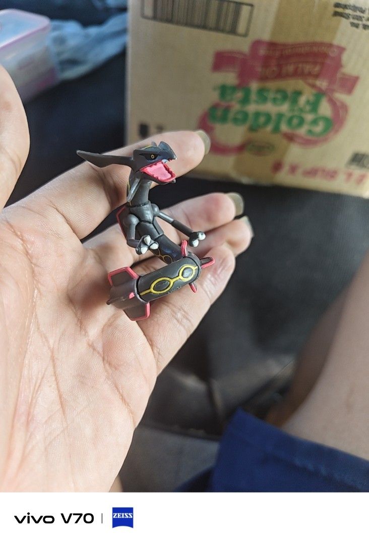 Shiny Rayquaza Pokémon Figure (Category: Figurines & Statues) located in Kapangan. Submitted by ClumZyDale (Listing ID 1468085006, Image 1). Description: - Shiny Rayquaza Pokémon mini figurine - Sleek black body with iconic red markings and yellow ring patterns - Features detailed head crest and tail fins - Ideal collectible for fans of the games and anime - Condition: Brand new / Great display piece.