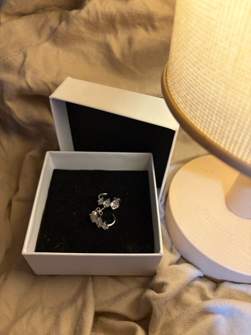 Silver teardrop cubic zirconia cluster earrings with box (Category: Earrings) located in Pasig City. Submitted by rotchie22 (Listing ID 1468237202, Image 1). Description: - Stunning silver-tone earrings with a cluster design - Features multiple sparkling, graduated teardrop-shaped cubic zirconia stones - Secure pierced style with comfortable post backs - Includes a elegant white gift box with a black velvet insert - Catch the light beautifully, p