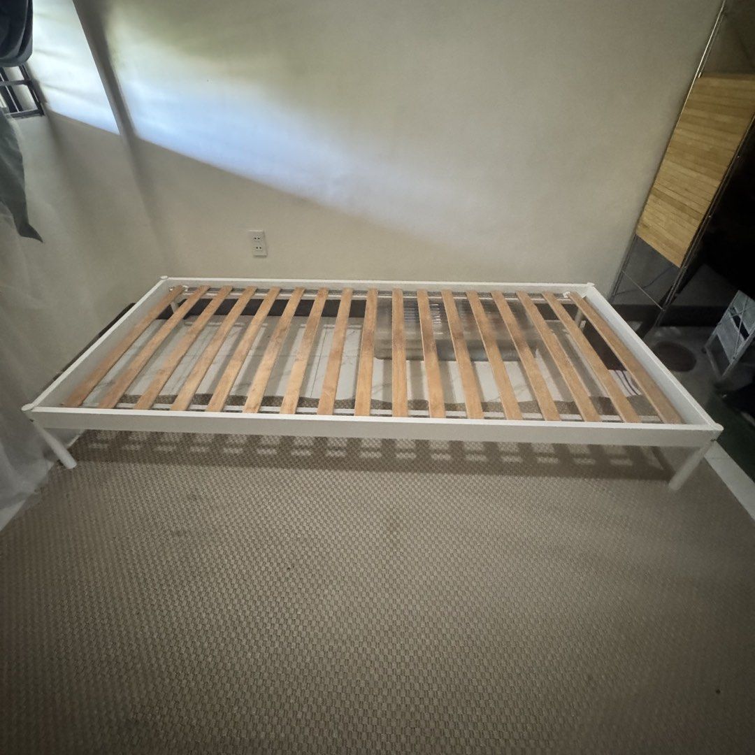 Single Bed - Metal Bed Frame - Ikea (Category: Bed Frames & Mattresses) located in Marikina City. Submitted by repurpose_studio (Listing ID 1468095321, Image 1). Description: - Item: IKEA VEVELSTAD Single Bed Frame - Color/Material: Clean white metal frame - Size: 90x200 cm - Inclusions: Wooden slatted base, all original screws, and parts - Condition: Sturdy build, disassembled and ready for transport - Delivery: Pick up only Reason of selling - 