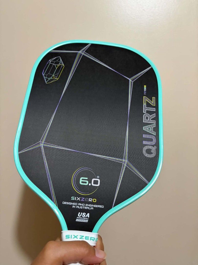 Six Zero Quartz 15MM Pickleball Paddle (Category: Racket and Ball Sports) located in Manila. Submitted by iamwencis (Listing ID 1468231227, Image 2). Description: 🏓 FOR SALE: Six Zero Quartz Prasiolite 💰 Price: ₱5,500 📦 Condition: Good as new 🗓️ Usage: 1 month only Freebies included: *Paddle cover *Transparent edge tape *Overgrip ✅ Edge tape installed since Day 1 ✅ Original plastic on the grip is still intact and has never been removed ✅ Well
