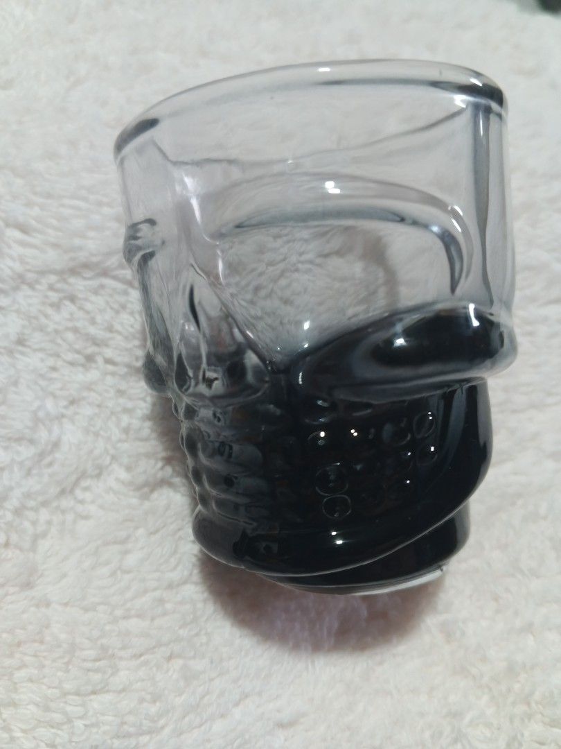 Skull Shot Glass Clear Glassware Gothic Barware (Category: Vintage Collectibles) located in Davao. Submitted by jmhocson (Listing ID 1468061810, Image 2). Description: - Unique human skull-shaped shot glass made of clear glass - Features a stylish gradient black ombre tint at the base and face details - Heavy glass base for a solid, premium feel in hand - Standard shot volume capacity - Perfect for Halloween gatherings, themed parties, and bar di