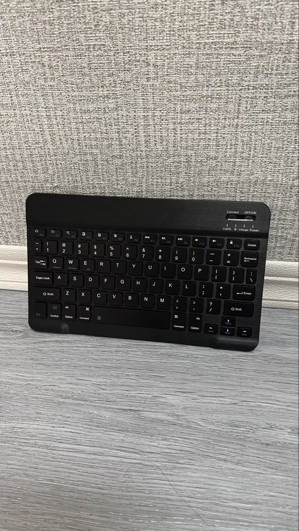 Slim Wireless Bluetooth Keyboard Black (Category: Computer Keyboard) located in Makati City. Submitted by glyzacatalan (Listing ID 1468085116, Image 2). Description: - Sleek black wireless keyboard compatible with tablets and phones - Compact QWERTY layout with handy multi-device shortcuts - Easy-to-use power switch and connect button located on the top right - Clear indicator lights for caps lock, charging status, and power - Lightweight and min