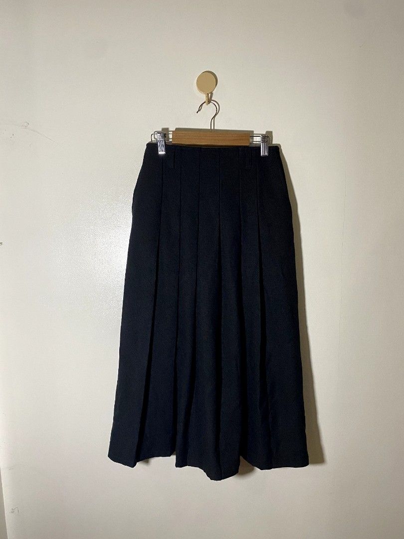 Small - GU A Line Pleated Skirt (Category: Skirts) located in Castillejos. Submitted by lalainecloset22 (Listing ID 1468184032, Image 2). Description: - Brand: GU (Uniqlo sister brand) - Style: A-Line Pleated Skirt - Size: S - Color: Classic Black - Material: 100% Polyester (lightweight and smooth) - Condition: Excellent, well-maintained - Versatile design perfect for casual outings, school, or preppy looks.