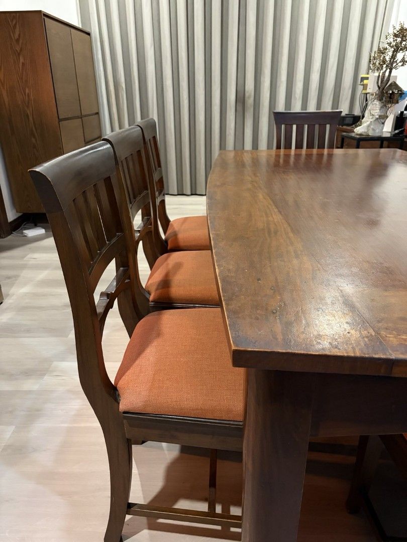 Solid narra dining table set with 8 chairs (Category: Tables & Sets) located in Taytay. Submitted by ljtumabini (Listing ID 1468120173, Image 3). Description: - Type: Solid narra dining table and 8 chairs: Table size : H: 75cm L: 198cm W: 105cm Chair size: H 47cm (including backrest 95cm) seat is 40cm x 44cm - Color/Finish: Rich brown wood with burnt orange fabric cushions - Capacity: Comfortably seats eight people - Style: Versatile design suits