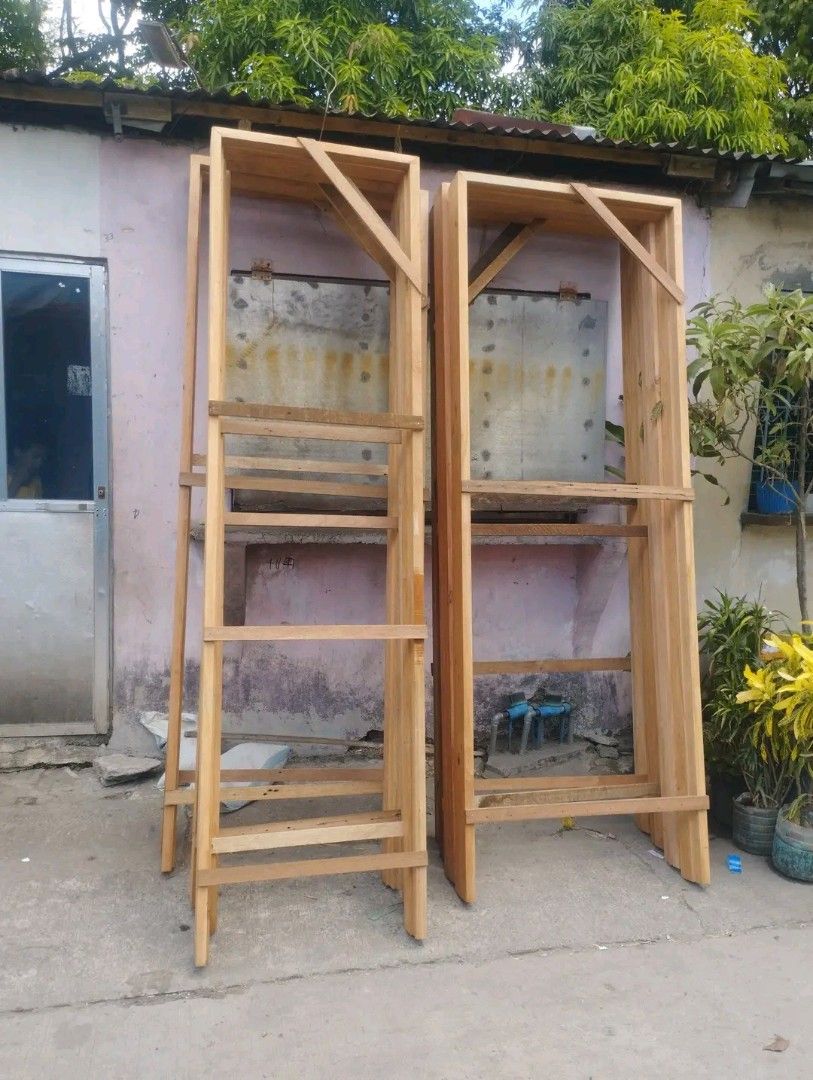 Solid Wooden Door Handcrafted Paneled Design (Category: Locks, Doors & Gates) located in Quezon City. Submitted by anglerose070187 (Listing ID 1468088789, Image 2). Description: - Handcrafted solid wood door with a heavy, durable build - Features traditional vertical panels and decorative round studs - Comes in a natural wood finish, ready for your choice of paint or stain - Sourced directly from a trusted local carpentry shop - Perfect for addin