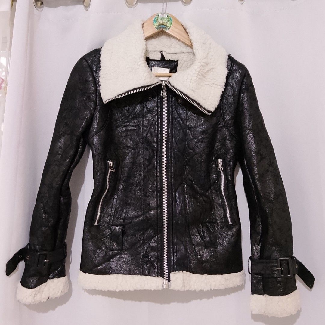 Someway Black Faux Shearling Aviator Jacket (Category: Coats, Jackets and Outerwear) located in Manila. Submitted by keencrystal.595c28 (Listing ID 1468155204, Image 1). Description: - Color: Black faux leather with soft white shearling lining - Closure: Silver front zipper and zippered side pockets - Details: Buckled sleeve cuffs and textured outer shell - Fit/Feel: Heavy, warm, and cozy outerwear ideal for cold weather.