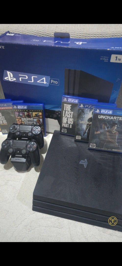 Sony DualShock 4 Wireless Controllers with Nyko Charging Dock (Category: Controllers) located in Manila. Submitted by benzcreen49158 (Listing ID 1468188681, Image 3). Description: - 2 Official Sony PlayStation 4 DualShock 4 Wireless Controllers (Standard Black) - Includes a Nyko charging station for easy power-ups - Rubber thumbsticks show moderate wear on the top controller; bottom controller is cleaner - Fully functional and ready for multiplay
