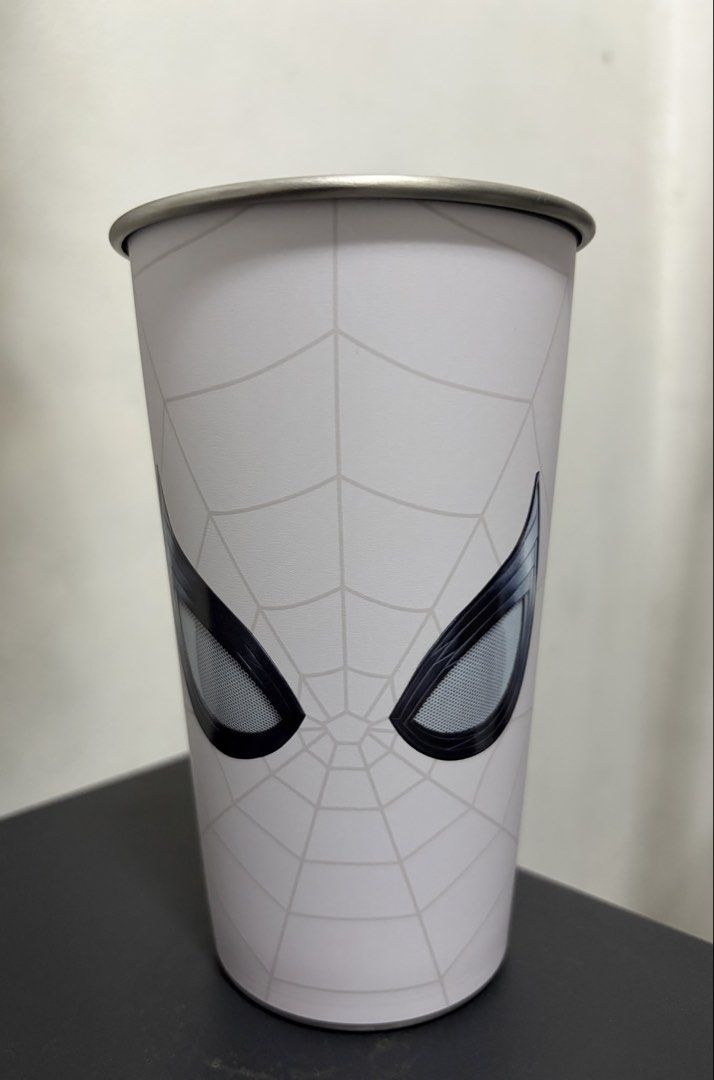 Spiderman Color Changing Cup 700 ml (Category: Water Bottles & Tumblers) located in Valenzuela. Submitted by nextdoor_finds (Listing ID 1468234881, Image 3). Description: - Official Marvel x Cotti Coffee Spider-Man merchandise - Unique reversible design featuring red and white colorways - Spider graphic with a city skyline silhouette cutout inside - Premium metal rim at the top - Features Cotti Coffee branding and copyright text at the base - Gre