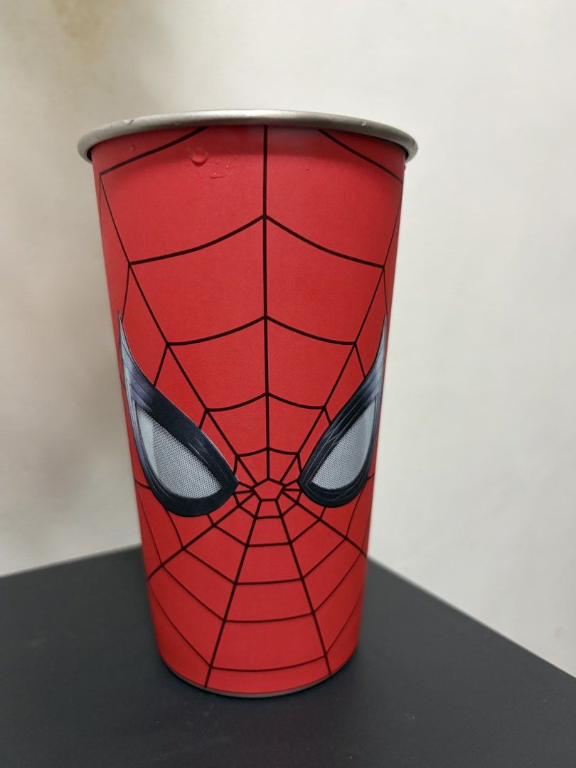 Spiderman Color Changing Cup 700 ml (Category: Water Bottles & Tumblers) located in Valenzuela. Submitted by nextdoor_finds (Listing ID 1468234881, Image 1). Description: - Official Marvel x Cotti Coffee Spider-Man merchandise - Unique reversible design featuring red and white colorways - Spider graphic with a city skyline silhouette cutout inside - Premium metal rim at the top - Features Cotti Coffee branding and copyright text at the base - Gre