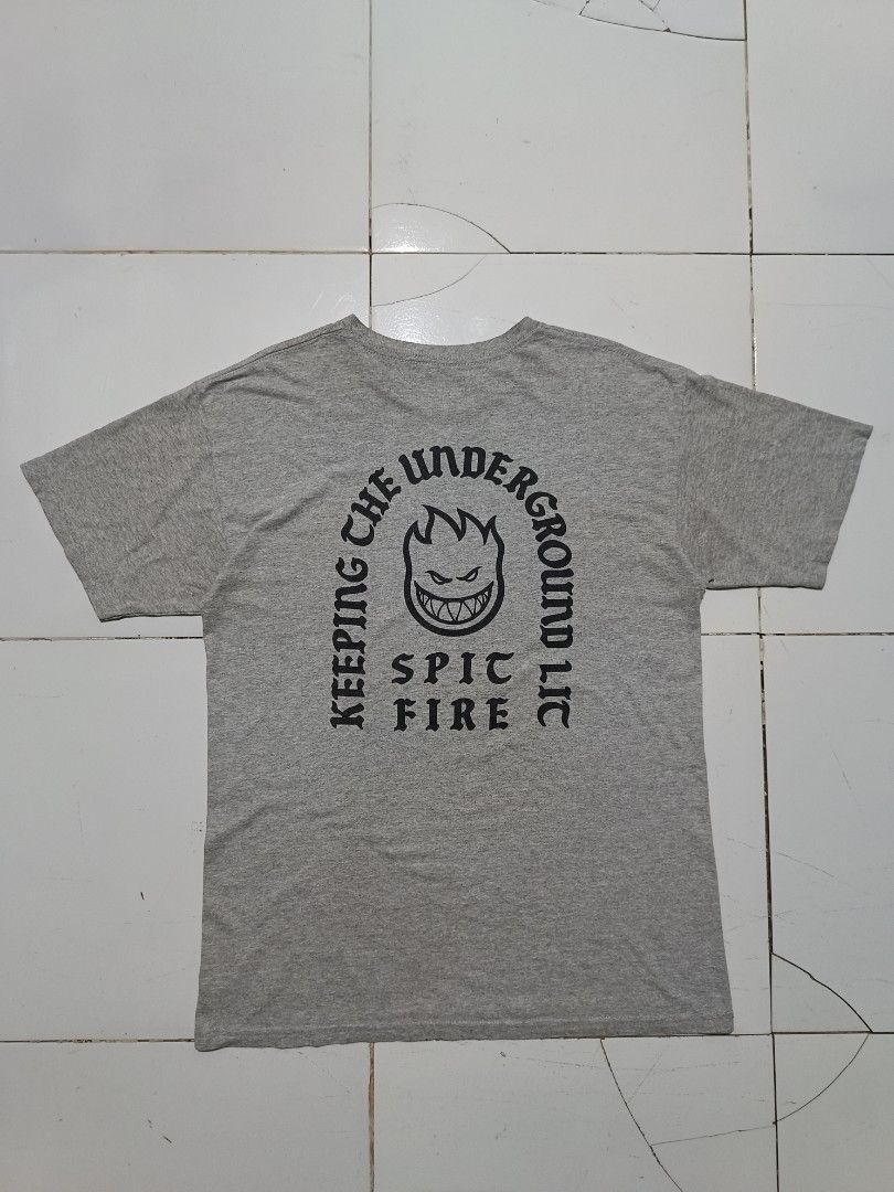 Spitfire Keeping The Underground Lit T-Shirt Heather Grey (Category: Tshirts & Polo Shirts ) located in Barotac Nuevo. Submitted by gray101 (Listing ID 1468207986, Image 1). Description: - Brand: Spitfire - Style: Skate t-shirt with back graphic - Color: Heather grey - Size: Medium - Details: Small Bighead chest logo, large 'Keeping The Underground Lit' back print, and red hem tag - Material: 90% polyester, 10% cotton blend - Origin: Made in Mexi