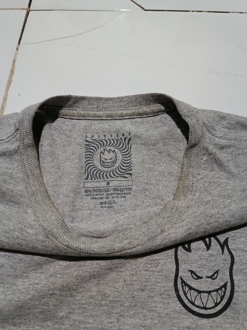 Spitfire Keeping The Underground Lit T-Shirt Heather Grey (Category: Tshirts & Polo Shirts ) located in Barotac Nuevo. Submitted by gray101 (Listing ID 1468207986, Image 3). Description: - Brand: Spitfire - Style: Skate t-shirt with back graphic - Color: Heather grey - Size: Medium - Details: Small Bighead chest logo, large 'Keeping The Underground Lit' back print, and red hem tag - Material: 90% polyester, 10% cotton blend - Origin: Made in Mexi