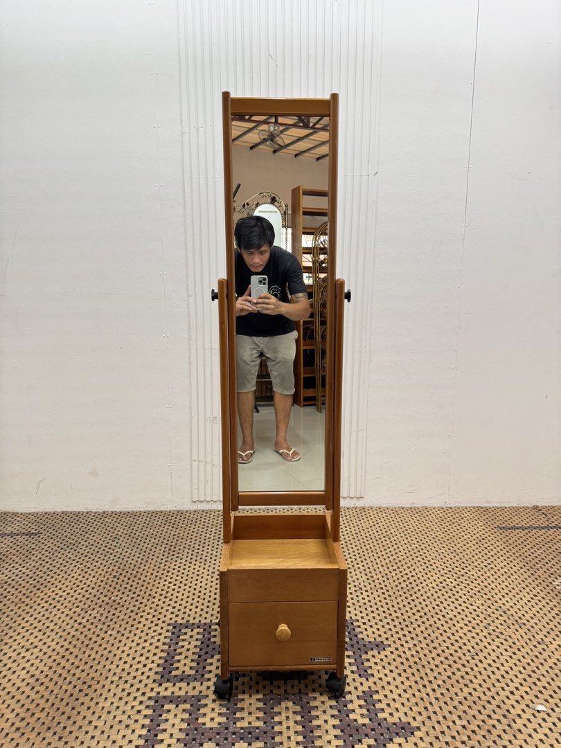 Stand Mirror (Category: Mirrors) located in Quezon City. Submitted by matetdevis13 (Listing ID 1468236664, Image 1). Description: FUKUDA CRAFT Vintage Wooden Standing Whole Body Mirror with Drawer and Roller Price: 4,900 L12 x H55 In good condition Code JMD20-M511.