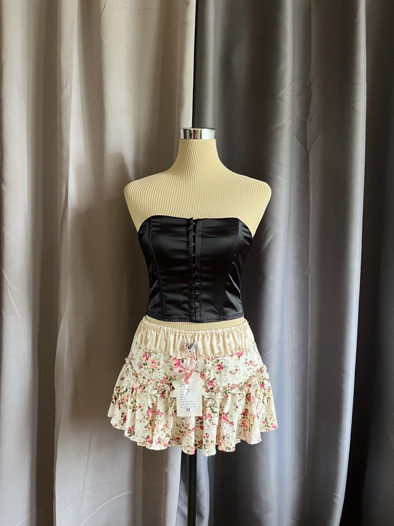 Glassons Strapless Satin Hook and Lace Up Corset Top (Category: Sleeveless) located in Cagayan de Oro. Submitted by curated_closetph (Listing ID 1468192855, Image 1). Description: —Size: XS - S — Color: Black — Smooth satin fabric with a subtle sheen — Strapless tube neckline — Front hook-and-eye closure — Adjustable lace-up ribbon back with metal grommets — Structured boning for waist shaping — Straight cropped hemline for versatile styling — Ca