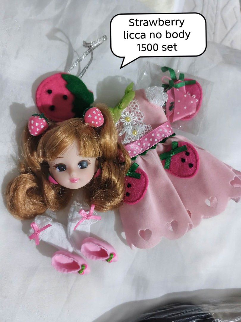 Strawberry Licca doll head and outfit set (Category: Kids Toys) located in Rizal. Submitted by kws_onlineshop (Listing ID 1468149904, Image 1). Description: - Strawberry Licca doll set (Doll body NOT included) - Includes doll head with adorable brown twin ponytails - Complete strawberry-themed outfit: pink dress, matching bag, socks, and pink shoes - Perfect cute addition for doll collectors - Ships securely from a trusted Carousell seller loc im