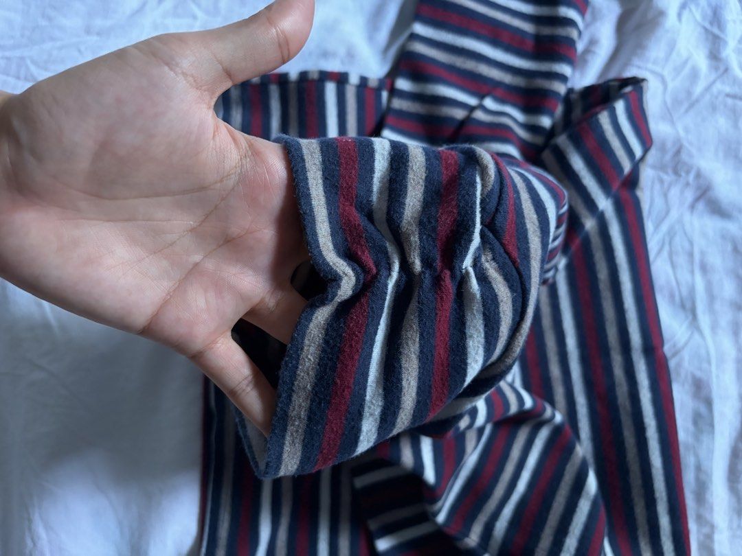 Striped Turtleneck Long Sleeve Top (Category: Longsleeves) located in General Santos City (Dadiangas). Submitted by jwtfg (Listing ID 1468111188, Image 2). Description: - Multi-colored striped turtleneck shirt (Blue, red, cream, and dark stripes) - Soft fleece-like fabric texture inside for extra warmth - Features long sleeves and a high neck collar - Standard fit, perfect as a casual layering piece for cooler weather.