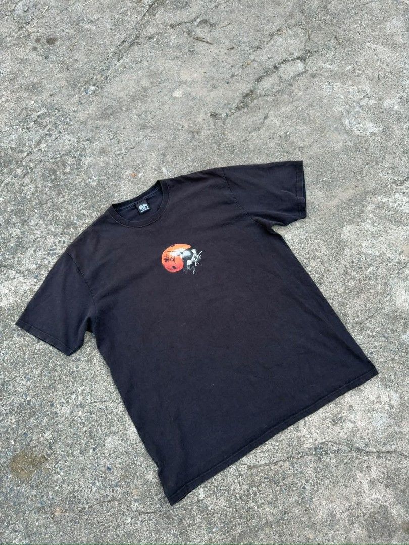 Stussy Ladybug Graphic Tee Black Size XL (Category: Tshirts & Polo Shirts ) located in Manila. Submitted by silentstone.4b0628 (Listing ID 1468059741, Image 2). Description: - Brand: Stussy - Color: Washed black (soft faded texture) - Size: XL (tagged, made in Honduras) - Design: Detailed ladybug graphic with embedded Stussy logo on the front chest - Fit: Classic crew neckline and short sleeves - Condition: Pre-loved with a great vintage look.