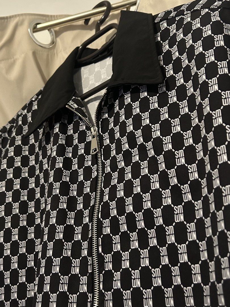 Sumwon Black White Monogram Zip Short Sleeve BOXY FIT (Category: Tshirts & Polo Shirts ) located in Dasmarinas. Submitted by brandedstuff.est2022 (Listing ID 1468170640, Image 2). Description: - Brand: Sumwon - Style: Short sleeve shirt with black & white monogram pattern - Closure: Full front zipper with silver hardware - Collar: Solid black lapel collar - Size: Medium (tag attached) - Condition: Clean stitching, lightweight, and comfortable fab