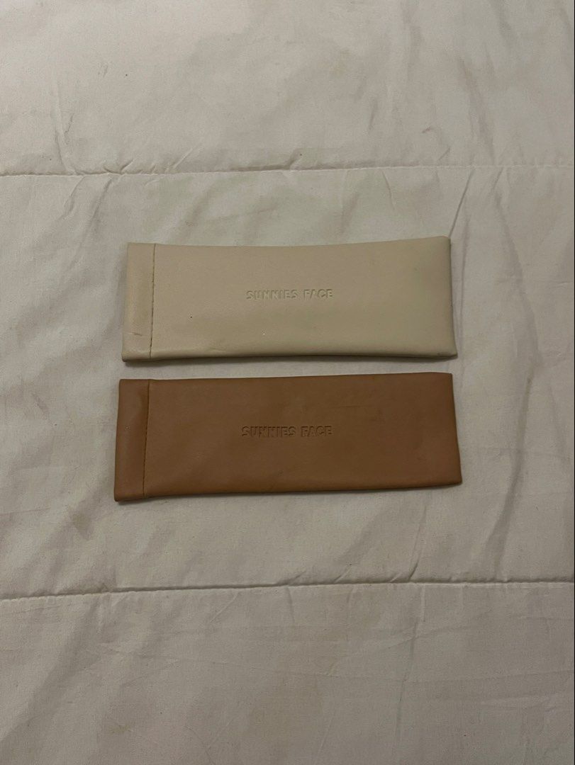 Sunnies Face Brushes Case Beige and Brown (Category: Sunglasses & Eyewear) located in Manila. Submitted by beautyarchives (Listing ID 1468209979, Image 1). Description: sunnies face brush holder set a chic and practical way to keep your beauty brushes protected wherever you go • set of 2 brush holders in cream beige and tan brown • soft faux leather material with embossed sunnies face logo • slim, lightweight design that fits easily into any bag 