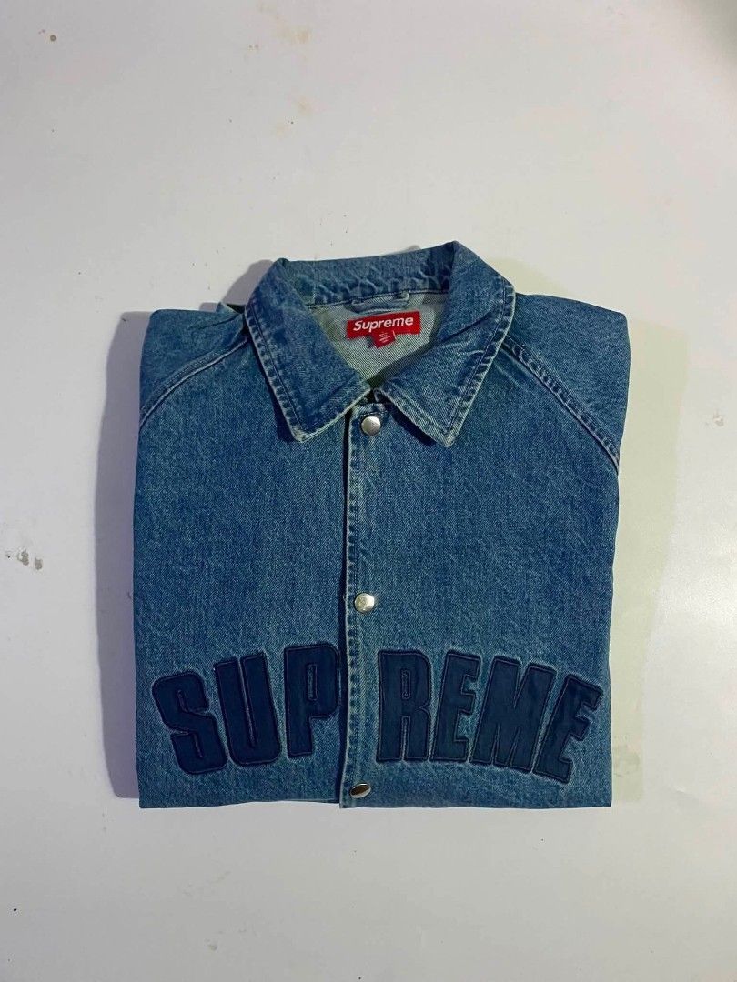 Supreme Denim Coach Jacket Blue Size L (Category: Coats, Jackets and Outerwear) located in San Juan City. Submitted by findmorelux (Listing ID 1467786453, Image 2). Description: - Brand: Supreme - Item: Denim Coach Jacket - Color: Blue wash with dark navy embroidered chest branding - Size: Large (L) - Material: 100% Cotton - Features: Snap button front, collared neckline, elasticized cuffs and hem, red box logo tag - Condition: Brand new / Excell