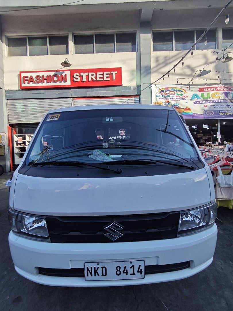 Suzuki Carry UV Manual (Category: Used Cars) located in Manila. Submitted by zealdragon.e46f60 (Listing ID 1468168671, Image 1). Description: QUICK SPECS: Transmission: Manual (MT) Engine: 1.5L Gas (Very healthy, smooth drive) Body: FB Utility Van with sliding windows Status: Private use / Not For Hire CONCESSIONS (See Photos): Cracked right headlight lens (bulb works, needs new headlight lens) Minor dent with paint chip on side panel Shallow scr