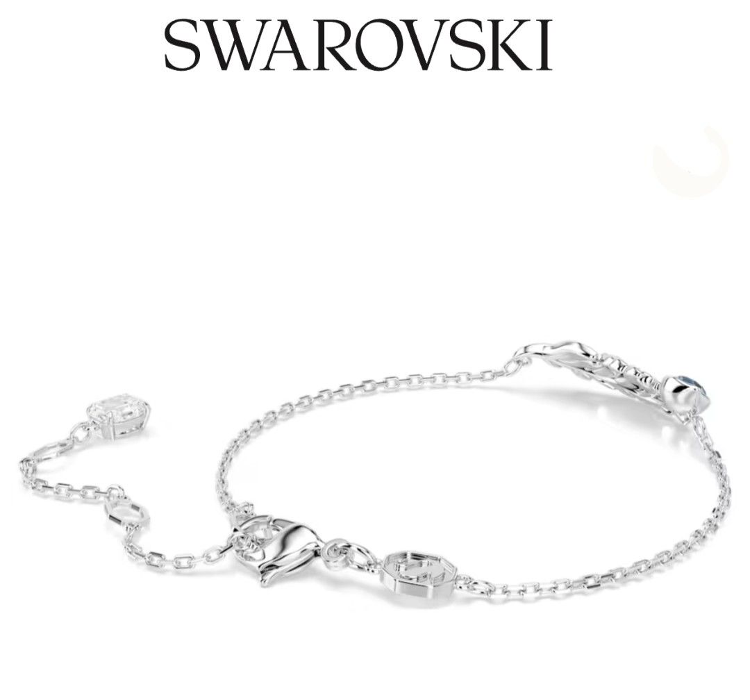 Swarovski Nice Feather Blue Crystal Silver Bracelet (Category: Bracelets) located in Bacoor. Submitted by ourpersonalstuffs (Listing ID 1468065303, Image 3). Description: Swarovski bracelet with a detailed feather centerpiece, pavé crystals, and a deep blue stone. Rhodium plated finish. Adjustable chain featuring a dangling crystal charm at the end and the iconic Swarovski swan tag near the lobster clasp. Delicate look on the wrist, catches the l