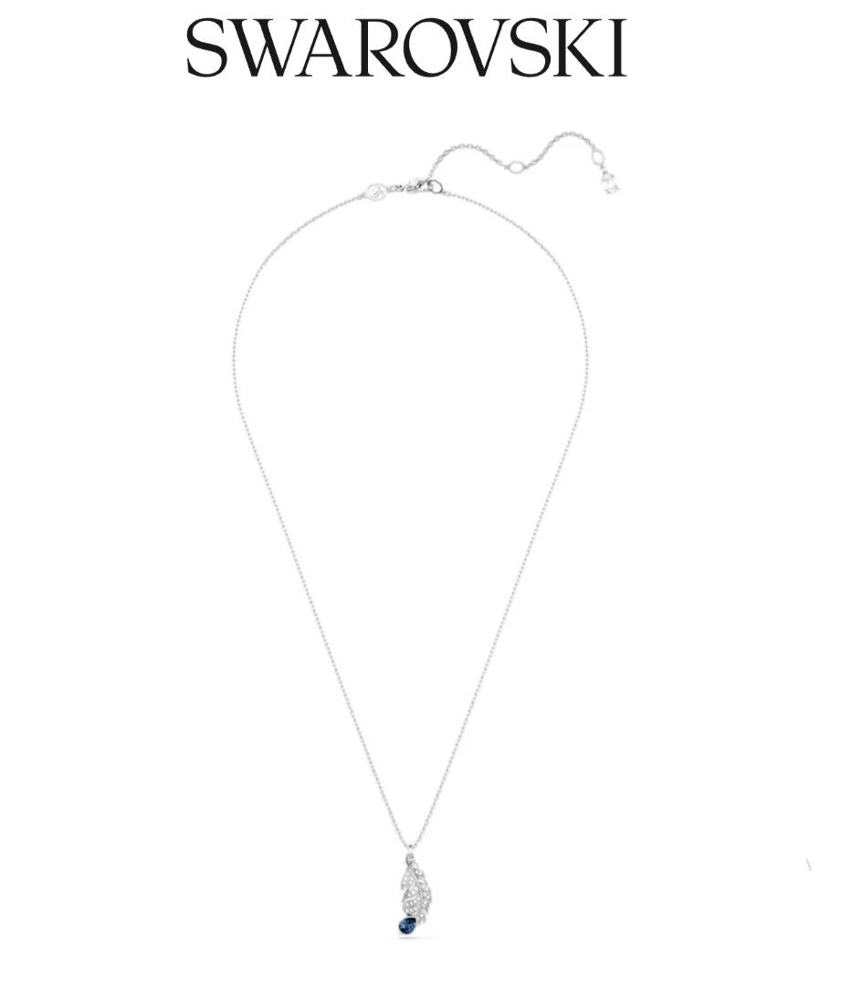 Swarovski Nice Feather Pendant Necklace Blue Silver (Category: Necklaces) located in Bacoor. Submitted by ourpersonalstuffs (Listing ID 1468066324, Image 3). Description: - Brand: Swarovski - Design: Detailed silver-tone feather pendant paved with clear crystals - Accent: Dark blue teardrop crystal at the tip - Closure: Adjustable chain link with lobster clasp - Details: Signature Swarovski swan logo charm near the clasp - Style: Elegant and vers