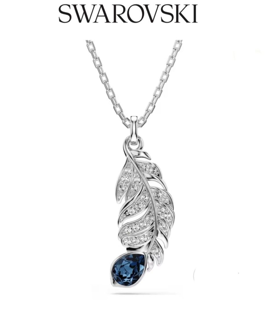 Swarovski Nice Feather Pendant Necklace Blue Silver (Category: Necklaces) located in Bacoor. Submitted by ourpersonalstuffs (Listing ID 1468066324, Image 1). Description: - Brand: Swarovski - Design: Detailed silver-tone feather pendant paved with clear crystals - Accent: Dark blue teardrop crystal at the tip - Closure: Adjustable chain link with lobster clasp - Details: Signature Swarovski swan logo charm near the clasp - Style: Elegant and vers