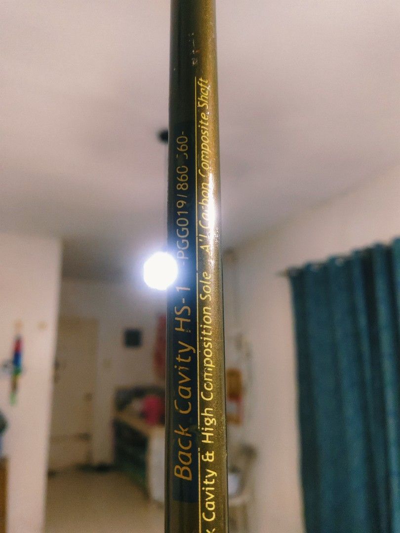 Sword Alpha Back Cavity HS-1 Golf Club (Category: Golf) located in Bulacan. Submitted by babz30261 (Listing ID 1468205368, Image 3). Description: - Brand/Model: Sword Alpha Back Cavity HS-1 (Model PGG019/860 60-) - Design: Dark green clubhead with elegant gold detailing and circular emblem sticker - Sole: High composition sole for solid performance - Shaft: Carbon composite shaft with standard markings visible - Condition: Solid construction, dep