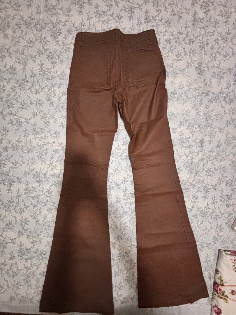 Tall Flare Leg Leather pants (Category: Jeans) located in Valenzuela. Submitted by sasha2802 (Listing ID 1468200234, Image 2). Description: - Rust brown with a glossy finish - Button and zipper - Stretchy leather - closet declutter sale.