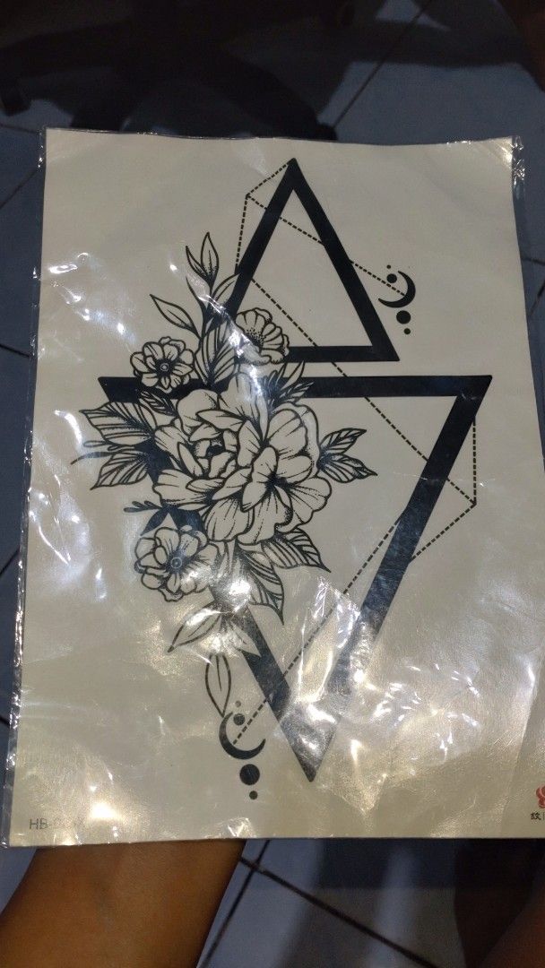 Tatoo and necklace set (Category: Bracelets) located in Valenzuela. Submitted by diane.35 (Listing ID 1468099322, Image 2). Description: - Set of 2 packaged fashion bracelets with black cords, silver-toned beads, and dolphin/claw charms - Includes 1 sheet of temporary tattoo transfer paper with geometric triangles, floral bouquets, and moon/star designs - All items brand new in original packaging with clear protective plastic wrap intact - Countr